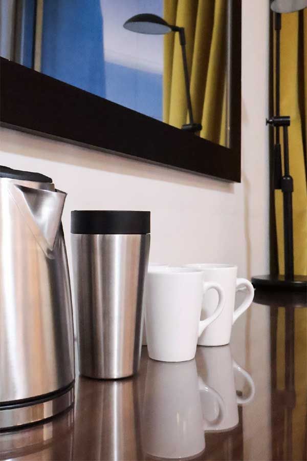 Green Reusable travel mugs