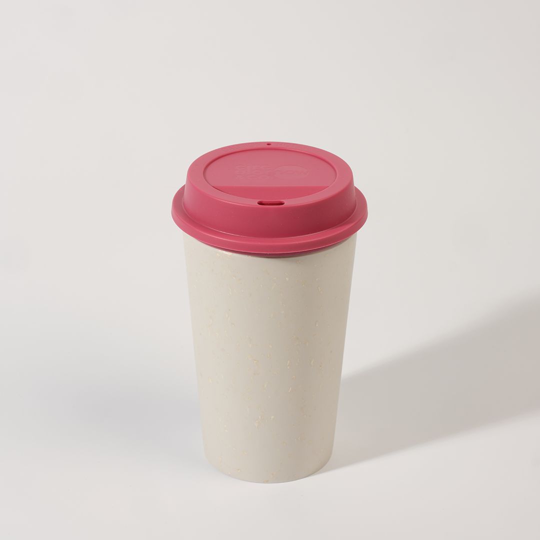 white reusable cup with pink lid