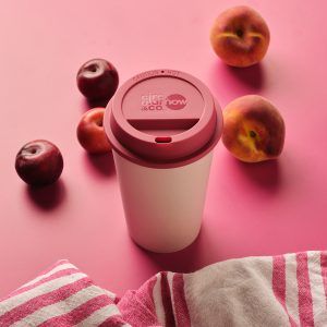 white reusable cup with pink lid