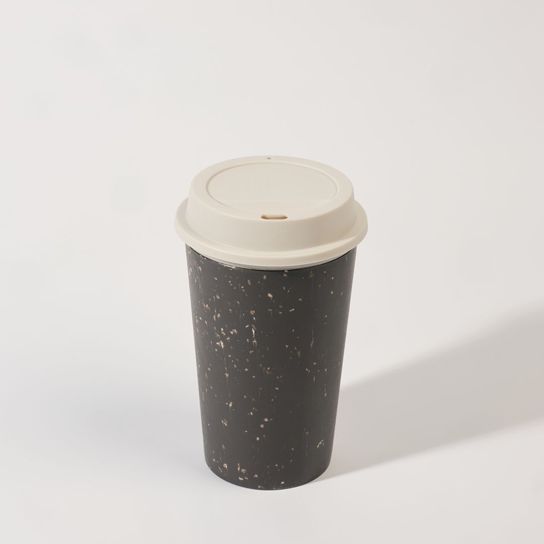 black reusable cup with white lid