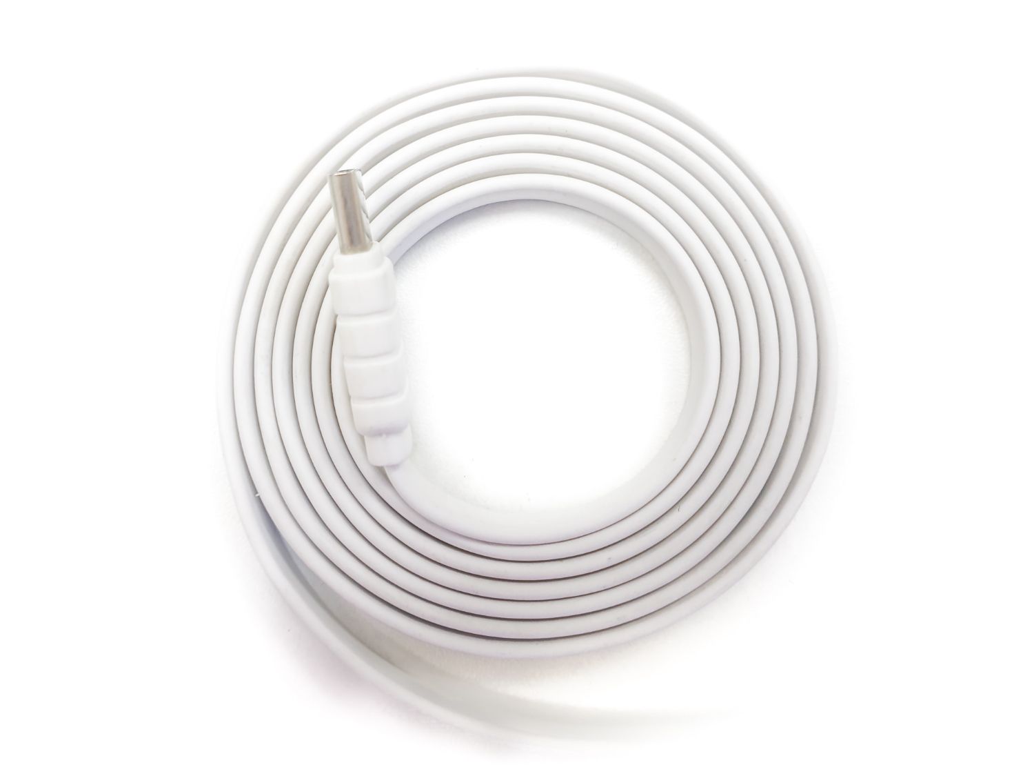 Overhead view of white computer cable wrapped up in a circle.