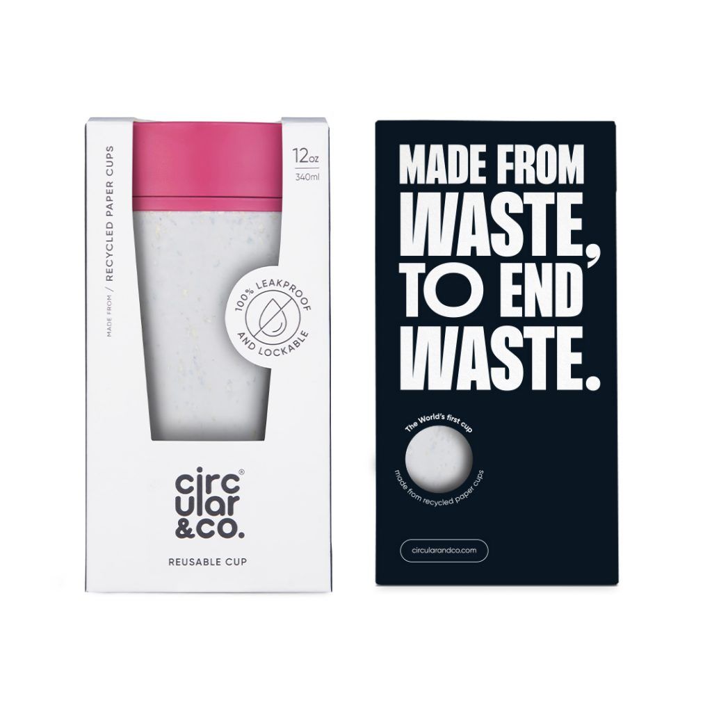 white reusable cup with pink lid in cardboard packaging