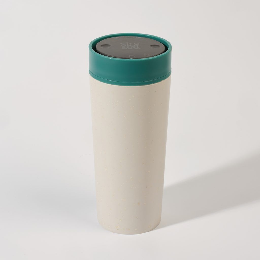 white reusable cup with green lid