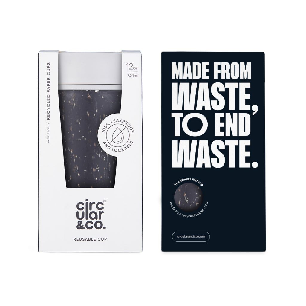 black reusable cup with white lid in cardboard packaging