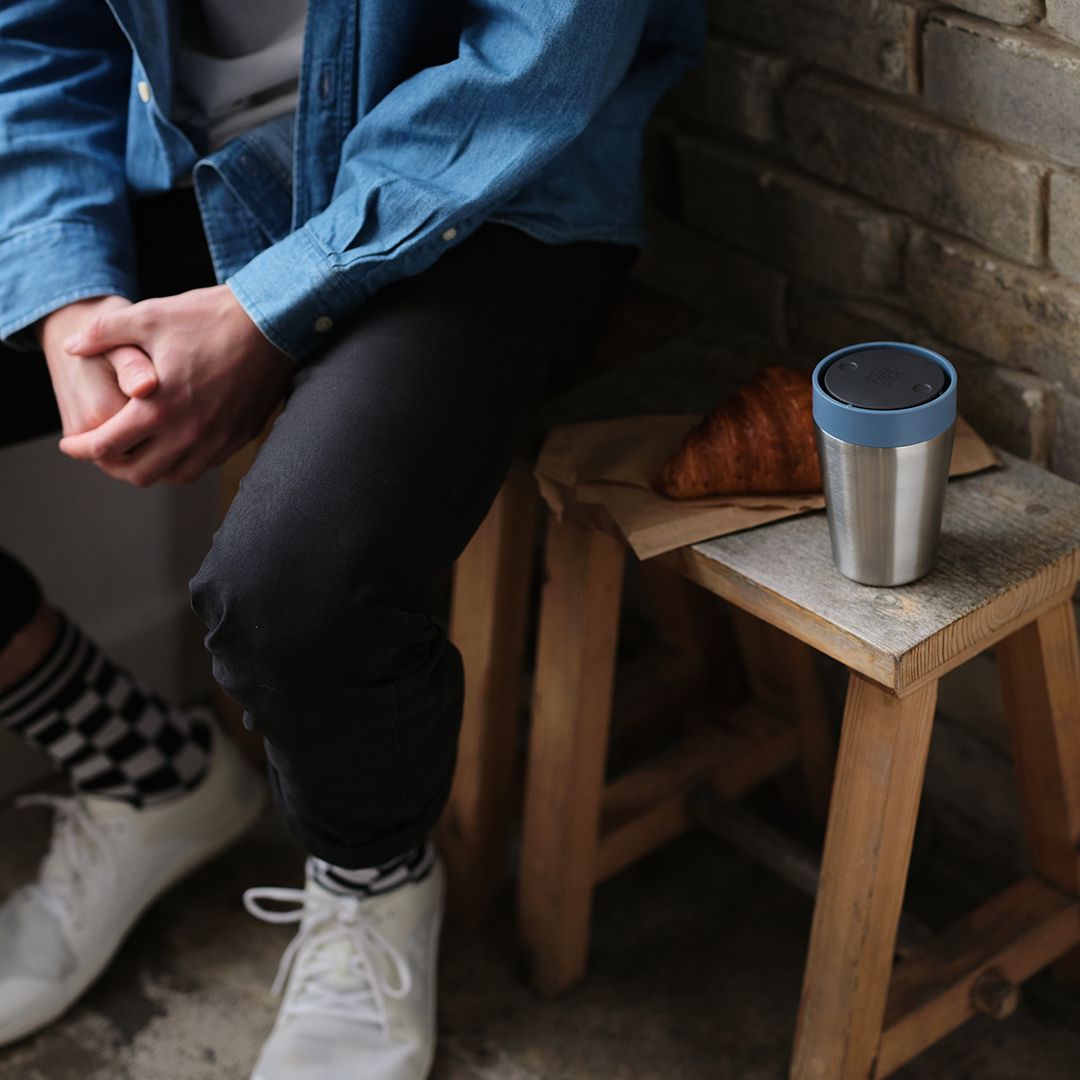 steel reusable cup on bench