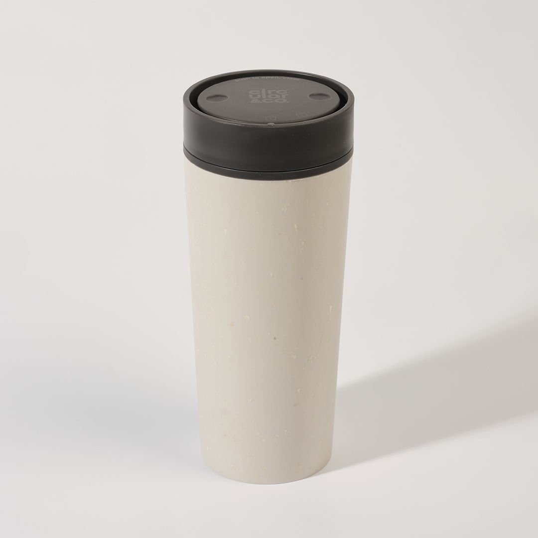 white reusable cup with black lid