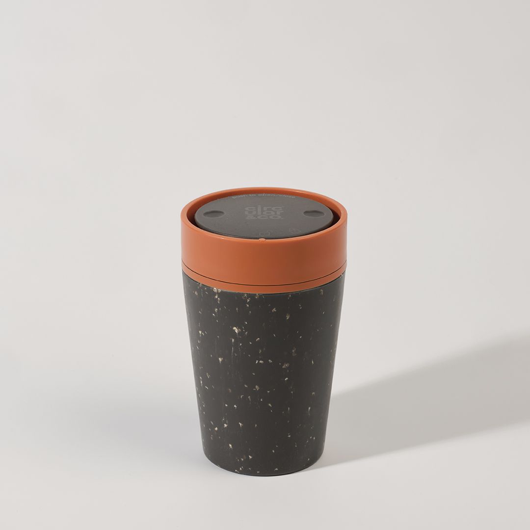 black reusable cup with orange lid