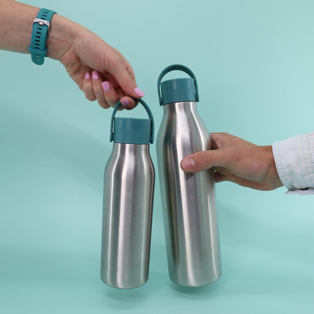 aquamarine green reusable stainless steel water bottles 1l and 500ml being held